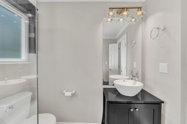 521 E Eastland St, Gallatin, TN 37066 - bathroom featuring toilet, crown molding, and vanity