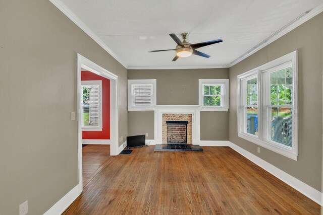 521 E Eastland St, Gallatin, TN 37066 - unfurnished living room with baseboards, a fireplace, ceiling fan, crown molding, and wood finished floors