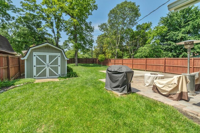 521 E Eastland St, Gallatin, TN 37066 - view of yard with a storage unit, an outdoor structure, a patio, and a fire pit