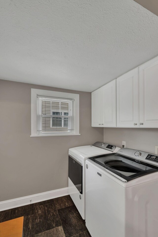 521 E Eastland St, Gallatin, TN 37066 - laundry area featuring washer and clothes dryer, cabinet space, baseboards, dark wood-style floors, and a textured ceiling