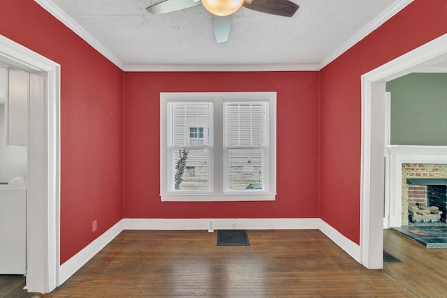 521 E Eastland St, Gallatin, TN 37066 - spare room with a ceiling fan, washer / clothes dryer, wood finished floors, and a fireplace
