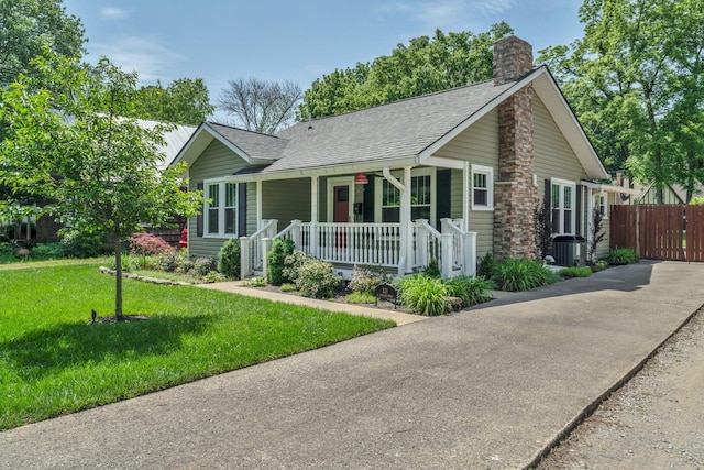 521 E Eastland St, Gallatin, TN 37066 - view of front of home featuring covered porch, a chimney, a shingled roof, and central air condition unit