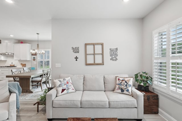 3706 Bonnie Blue Ct, Rockvale, TN 37153 - living area with light wood-style floors, recessed lighting, a chandelier, and baseboards