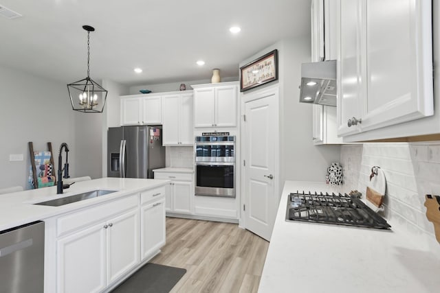 3706 Bonnie Blue Ct, Rockvale, TN 37153 - kitchen featuring a sink, appliances with stainless steel finishes, range hood, backsplash, and light countertops