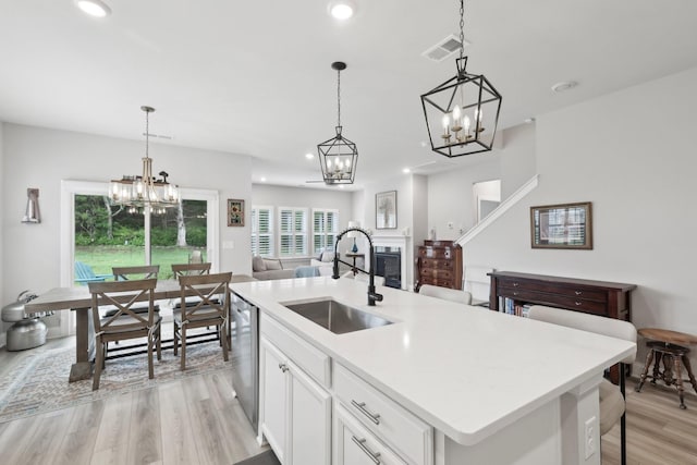 3706 Bonnie Blue Ct, Rockvale, TN 37153 - kitchen with a sink, a chandelier, dishwasher, light wood-style floors, and recessed lighting