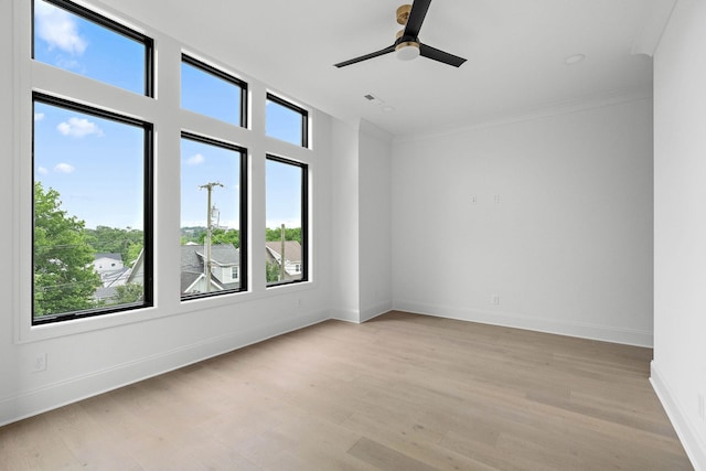 219 Chamberlin St, Nashville, TN 37209 - spare room featuring plenty of natural light, light wood-style floors, baseboards, ceiling fan, and crown molding