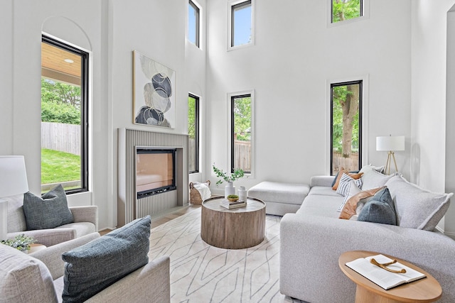 219 Chamberlin St, Nashville, TN 37209 - living area with plenty of natural light, a high ceiling, and a fireplace with flush hearth