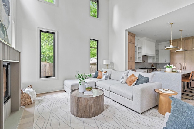 219 Chamberlin St, Nashville, TN 37209 - living area featuring a towering ceiling and light wood-style floors