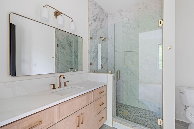 219 Chamberlin St, Nashville, TN 37209 - bathroom with a marble finish shower, toilet, and vanity