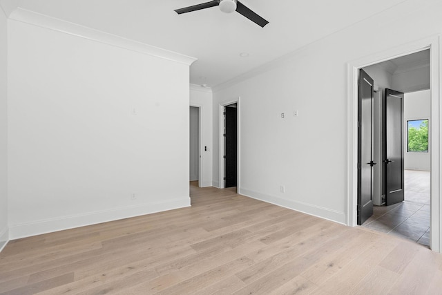 219 Chamberlin St, Nashville, TN 37209 - spare room featuring ceiling fan, ornamental molding, light wood-style floors, and baseboards