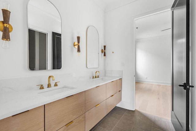 219 Chamberlin St, Nashville, TN 37209 - bathroom featuring double vanity, baseboards, and tile patterned floors