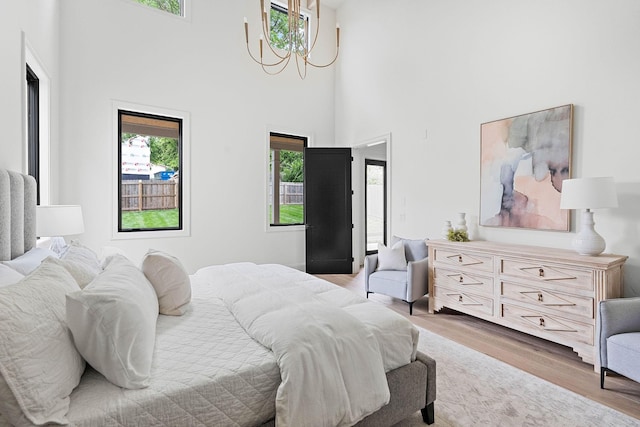 219 Chamberlin St, Nashville, TN 37209 - bedroom with a chandelier, wood finished floors, and a high ceiling