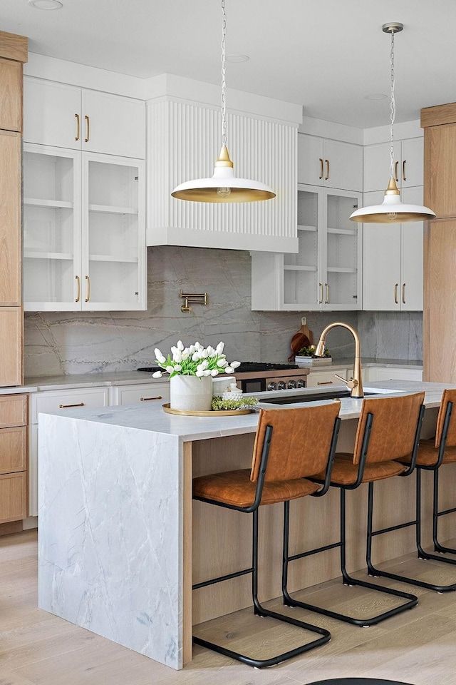 219 Chamberlin St, Nashville, TN 37209 - kitchen with decorative backsplash, light countertops, and decorative light fixtures