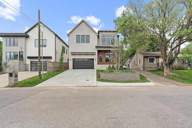 219 Chamberlin St, Nashville, TN 37209 - view of front of property featuring concrete driveway and an attached garage
