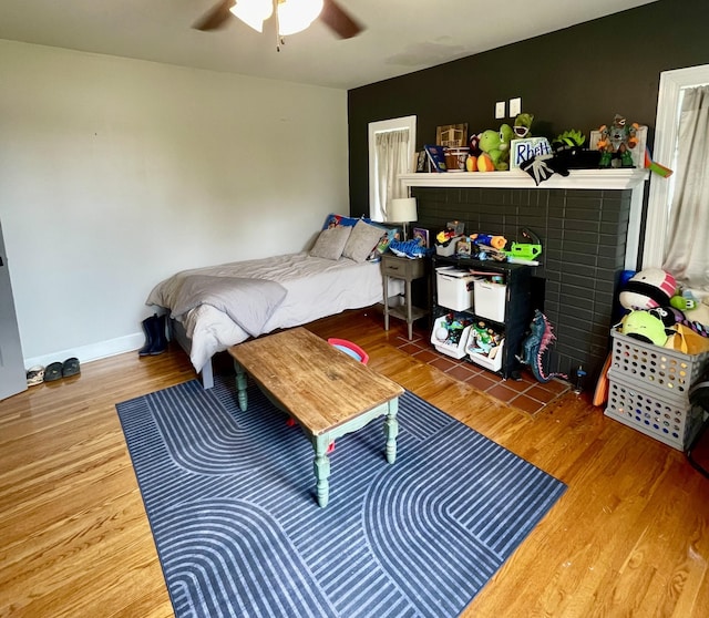 233 Shelton Dr, Saint Joseph, TN 38481 - bedroom featuring wood finished floors, a ceiling fan, and baseboards