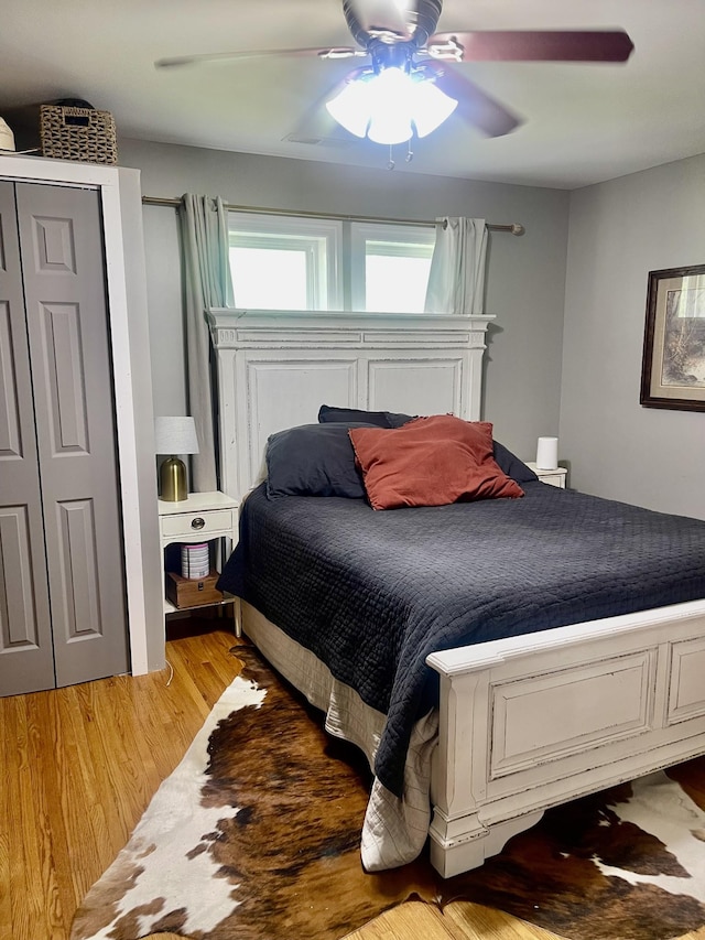 233 Shelton Dr, Saint Joseph, TN 38481 - bedroom with light wood-type flooring, a ceiling fan, and a closet