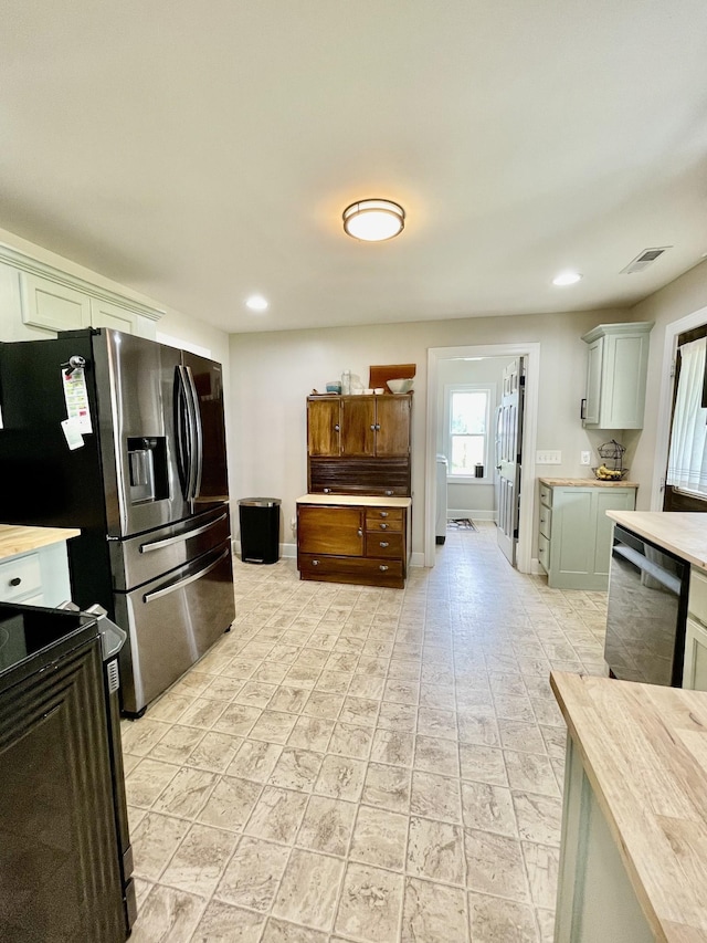233 Shelton Dr, Saint Joseph, TN 38481 - kitchen featuring appliances with stainless steel finishes, light countertops, recessed lighting, and baseboards