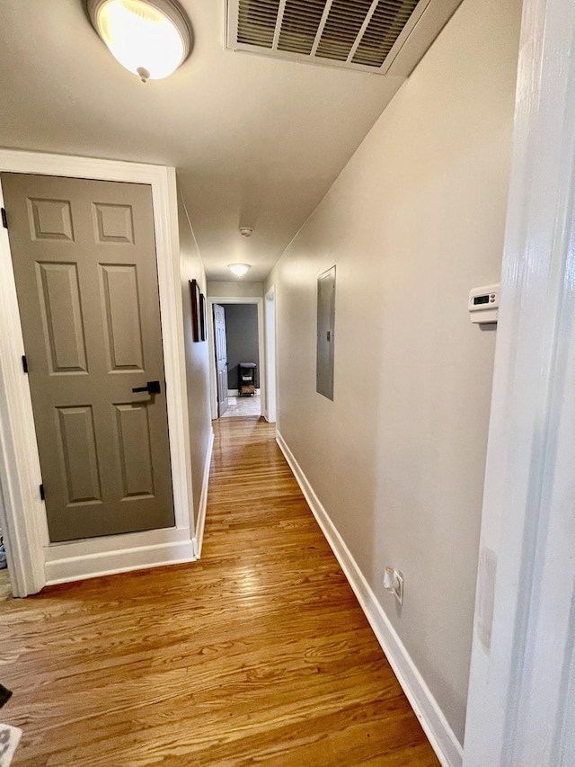 233 Shelton Dr, Saint Joseph, TN 38481 - hallway featuring wood finished floors, baseboards, and electric panel