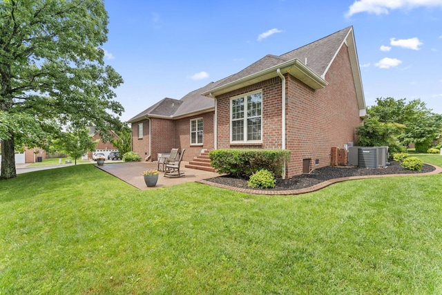 551 Bethany Cir, Murfreesboro, TN 37128 - rear view of house featuring brick siding, a patio area, a lawn, central AC unit, and roof with shingles