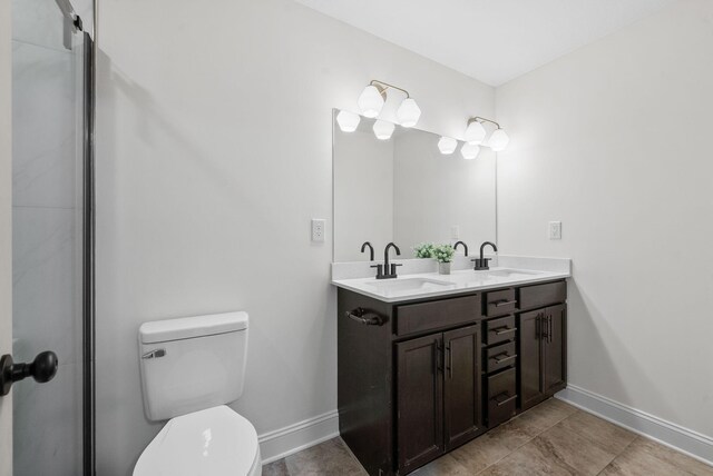 1021 Charles Thomas Dr, Clarksville, TN 37042 - full bath with toilet, baseboards, double vanity, and tile patterned floors