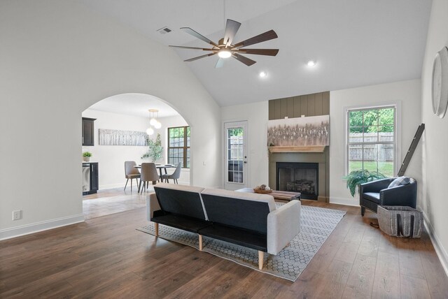 1021 Charles Thomas Dr, Clarksville, TN 37042 - living room with a fireplace, arched walkways, plenty of natural light, high vaulted ceiling, and a ceiling fan