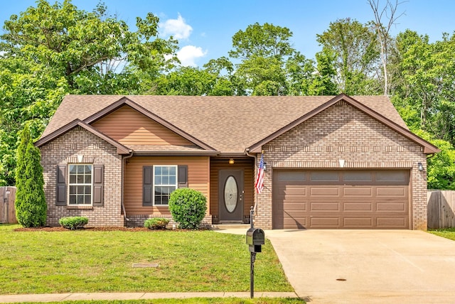 1021 Charles Thomas Dr, Clarksville, TN 37042 - ranch-style home featuring a shingled roof, a garage, driveway, and brick siding