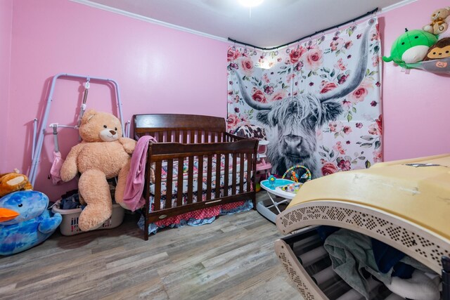 104 3rd Ave NW, Winchester, TN 37398 - bedroom with wood finished floors and crown molding