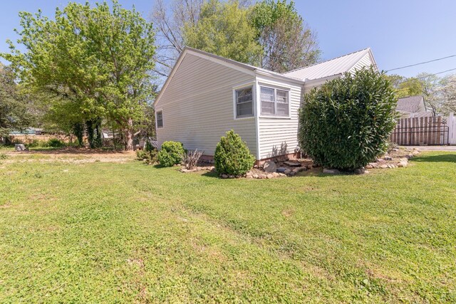 104 3rd Ave NW, Winchester, TN 37398 - view of side of home featuring metal roof