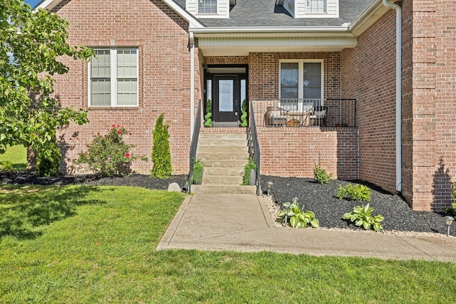 1007 Fairways Dr, Greenbrier, TN 37073 - entrance to property featuring a lawn, covered porch, brick siding, and roof with shingles