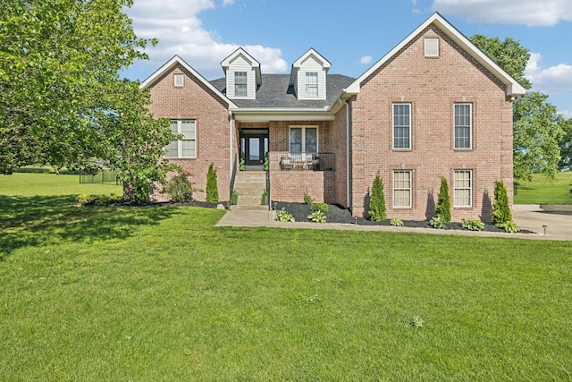 1007 Fairways Dr, Greenbrier, TN 37073 - view of front of home with a front yard, brick siding, and roof with shingles