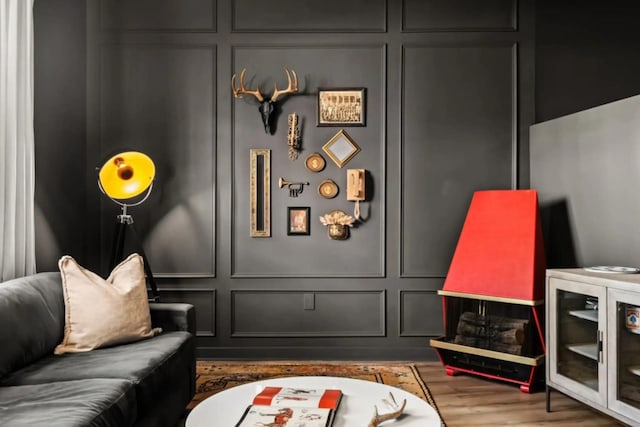 1700 Belcourt Ave Unit 103, Nashville, TN 37212 - living area with a decorative wall and wood finished floors