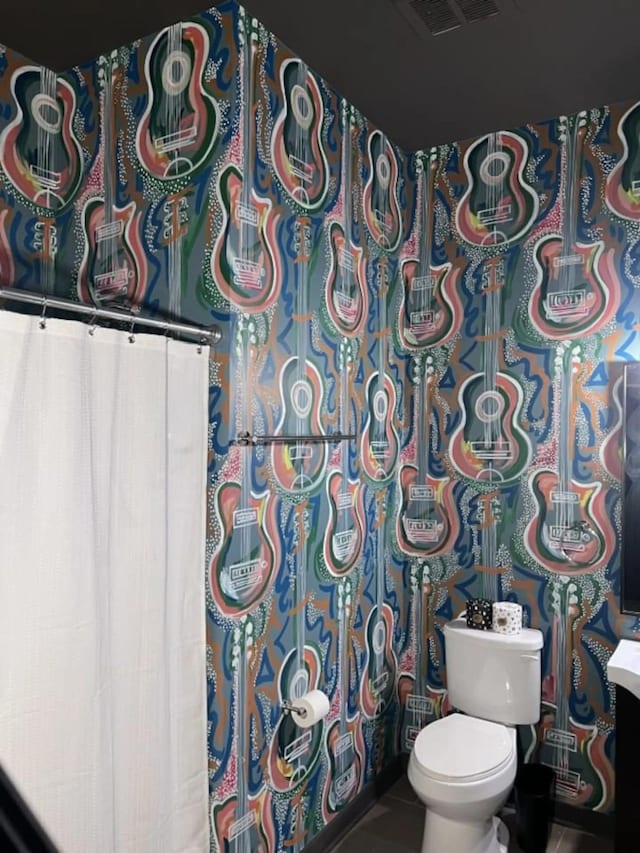 1700 Belcourt Ave Unit 103, Nashville, TN 37212 - bathroom featuring toilet and tile patterned flooring