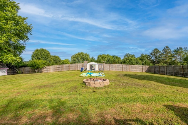 2659 Cave Springs Rd, Springfield, TN 37172 - view of yard featuring a fire pit, an outbuilding, and a storage shed