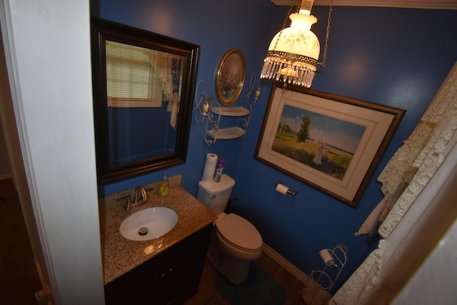 131 Scott Rd, Harriman, TN 37748 - bathroom with toilet, vanity, and baseboards