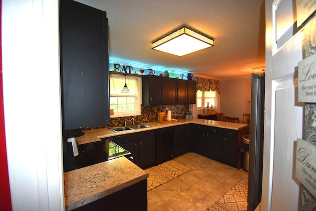 131 Scott Rd, Harriman, TN 37748 - kitchen with a sink, range, and tasteful backsplash