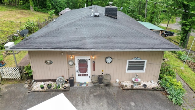 131 Scott Rd, Harriman, TN 37748 - view of front of house with a shingled roof, a chimney, and a patio area
