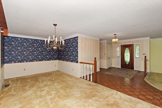 103 Colwell Ln, Manchester, TN 37355 - foyer with a chandelier, ornamental molding, a textured ceiling, and wainscoting