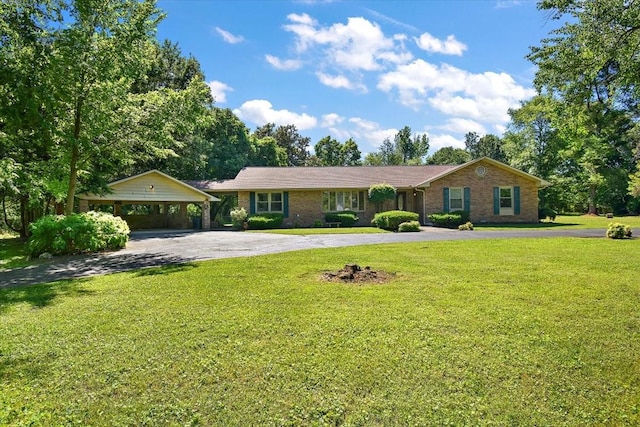 103 Colwell Ln, Manchester, TN 37355 - ranch-style home with asphalt driveway, a front yard, and brick siding