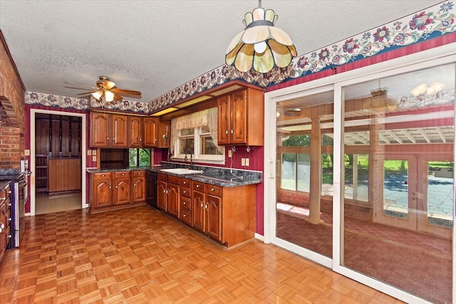 103 Colwell Ln, Manchester, TN 37355 - kitchen with a sink, a textured ceiling, dishwasher, healthy amount of natural light, and dark countertops