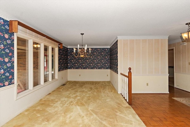 103 Colwell Ln, Manchester, TN 37355 - unfurnished dining area with a chandelier, wallpapered walls, crown molding, wainscoting, and a textured ceiling
