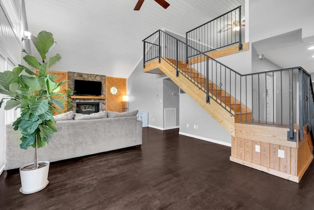 462 Clifford Dykes Rd, Tracy City, TN 37387 - living room featuring a ceiling fan, wood finished floors, a fireplace, a high ceiling, and baseboards