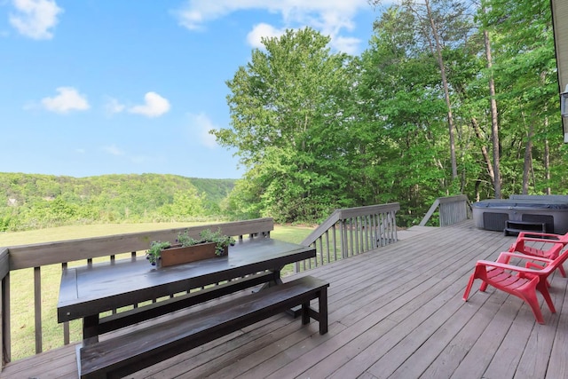 462 Clifford Dykes Rd, Tracy City, TN 37387 - wooden terrace with a hot tub, outdoor dining area, and a forest view