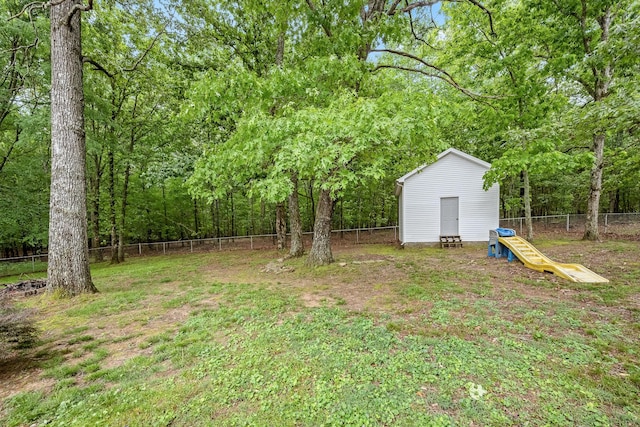 155 Deer Cir, Estill Springs, TN 37330 - fenced backyard featuring an outbuilding and a storage shed