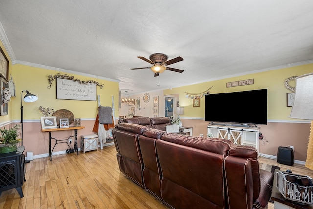 155 Deer Cir, Estill Springs, TN 37330 - living area with a ceiling fan, light wood finished floors, ornamental molding, baseboards, and a chandelier