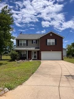 123 Arkansas Ct, Murfreesboro, TN 37129 - traditional-style house featuring an attached garage, concrete driveway, and a front yard