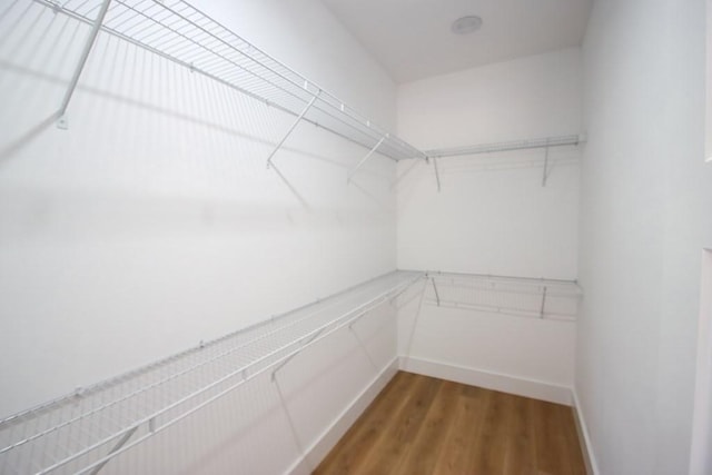 70 River Oaks Dr, Sparta, TN 38583 - spacious closet featuring wood finished floors