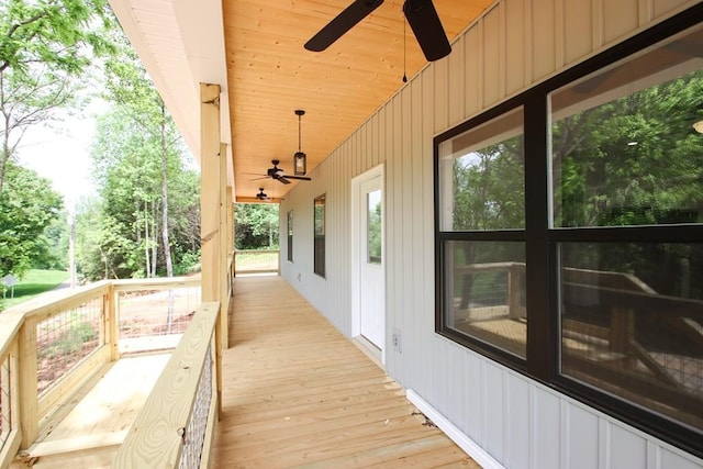 70 River Oaks Dr, Sparta, TN 38583 - wooden terrace featuring ceiling fan and view of wooded area