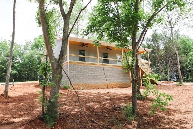 70 River Oaks Dr, Sparta, TN 38583 - back of house with a ceiling fan and stairway