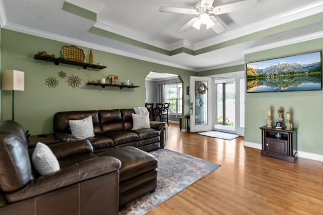 1383 Smith Chapel Rd, Shelbyville, TN 37160 - living area featuring arched walkways, wood finished floors, ceiling fan, crown molding, and baseboards