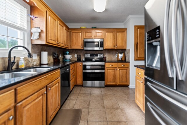 1383 Smith Chapel Rd, Shelbyville, TN 37160 - kitchen featuring appliances with stainless steel finishes, a sink, brown cabinets, and crown molding